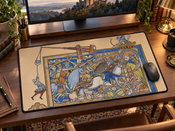 Medieval battle desk mat featuring knights, horses and siege artwork inspired by an illuminated manuscript beneath a keyboard and mouse
