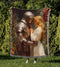 Knight and maiden woven cotton blanket with medieval romantic artwork and colourful fringed edges held outdoors